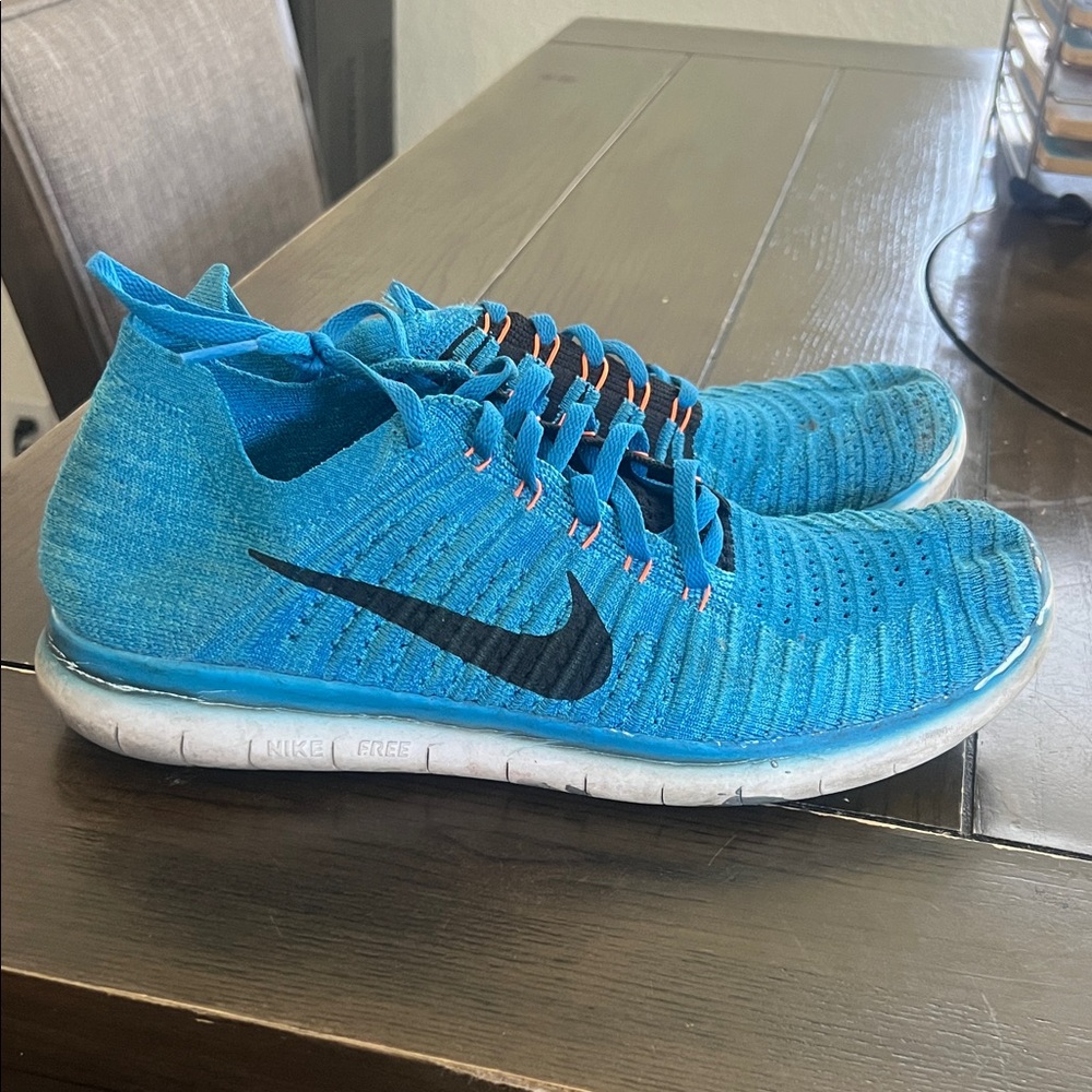Nike Men’s Flyknit Athletic Sneakers in Bright Blue with Black Swoosh